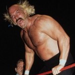 picture of shirtless Jesse Ventura, hair wild, mouth open